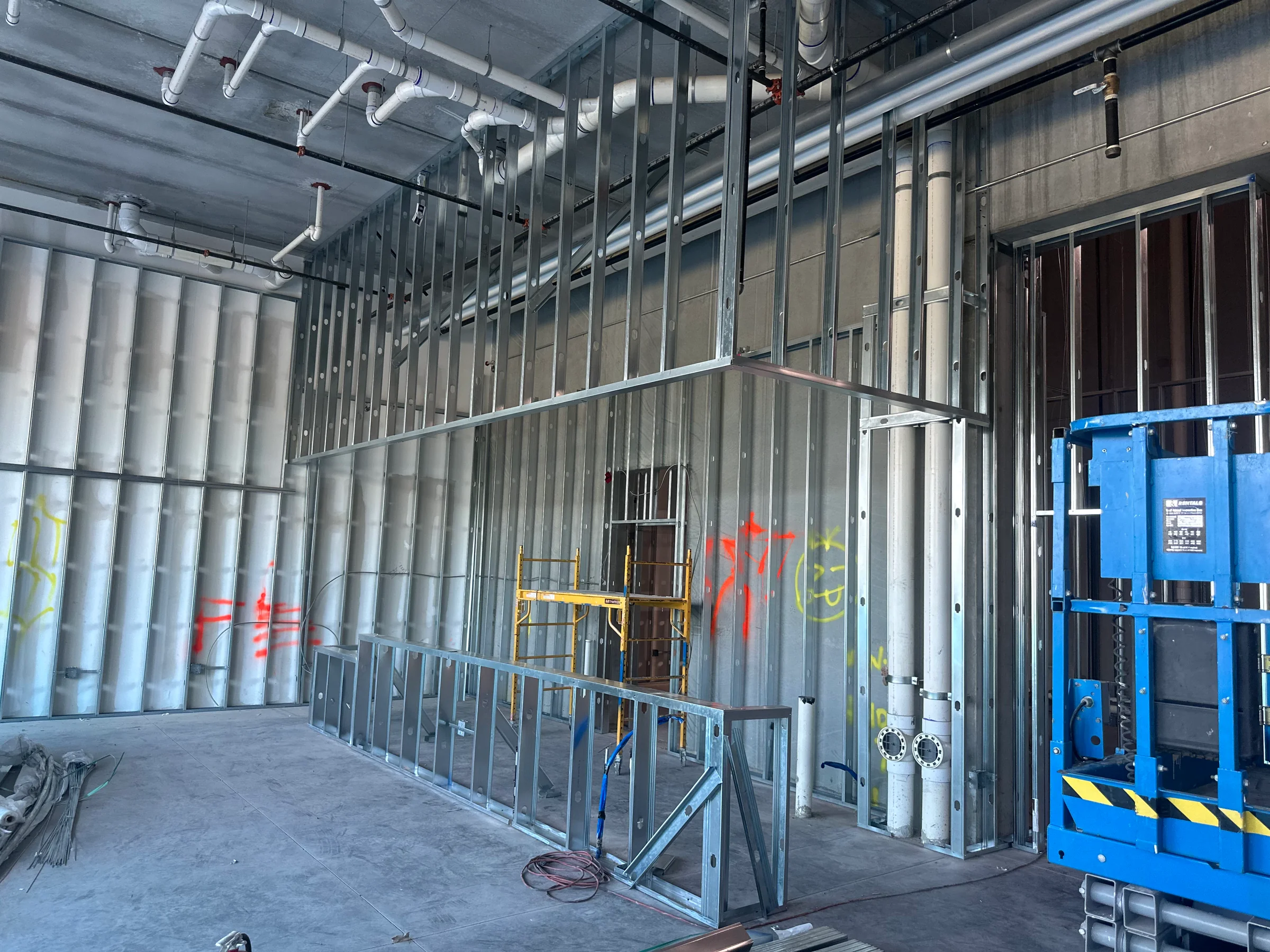 Commercial metal stud framing forming interior walls and door openings
