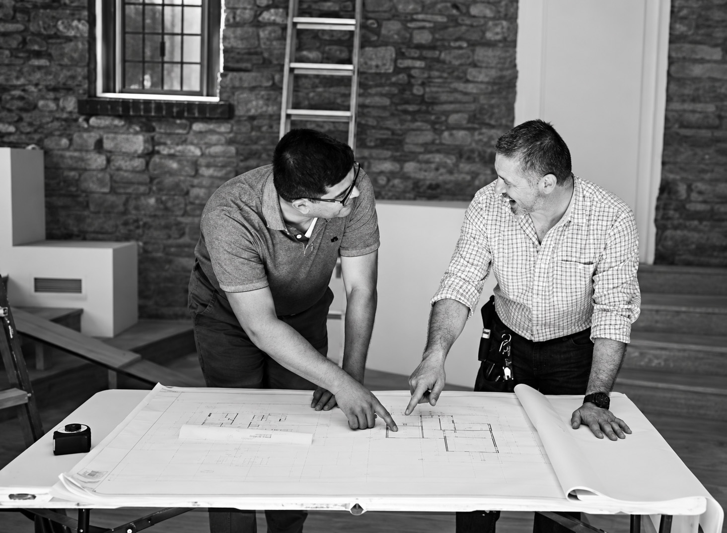 JAC Construction team reviewing architectural plans